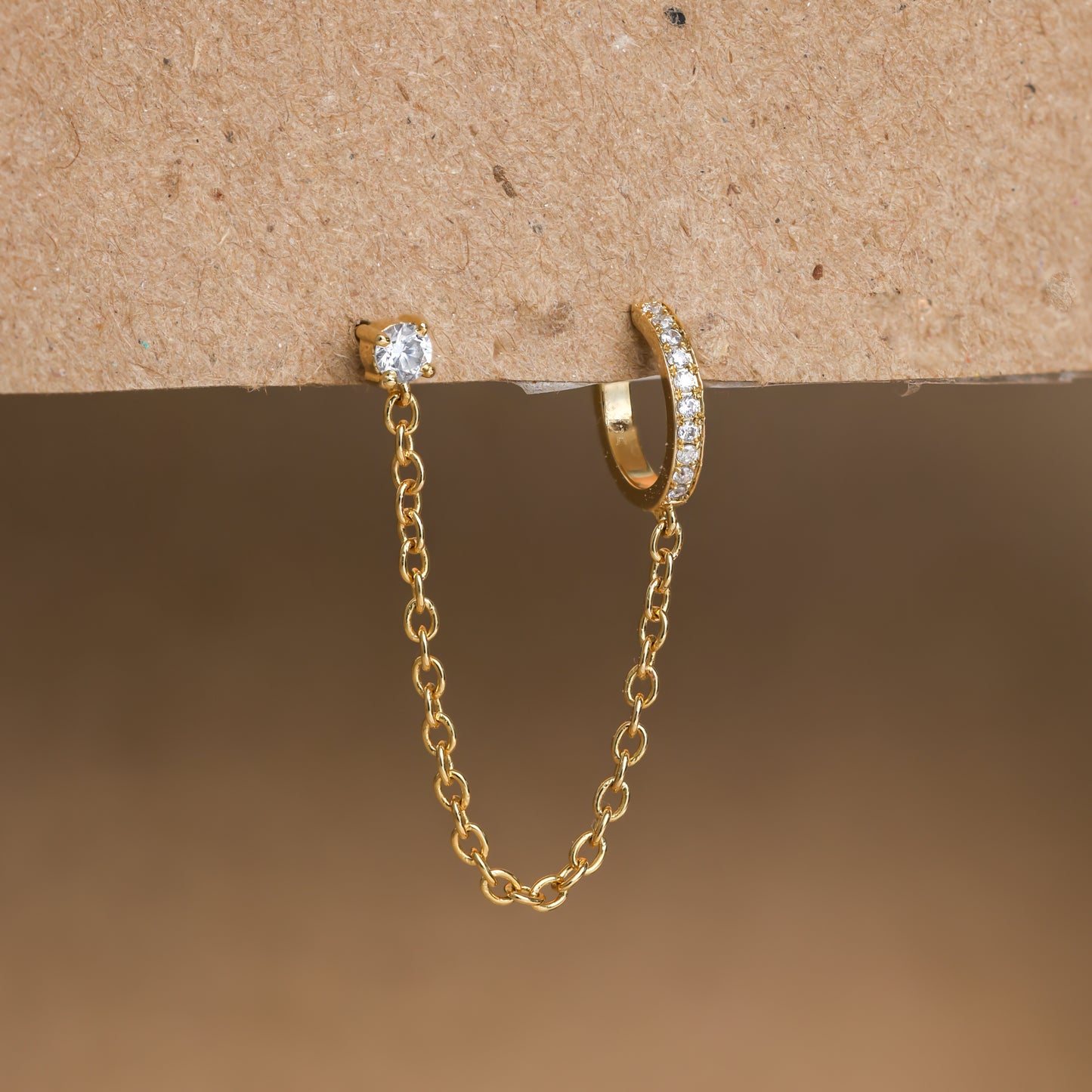 Elegant ear cuff featuring a pave-set chain design