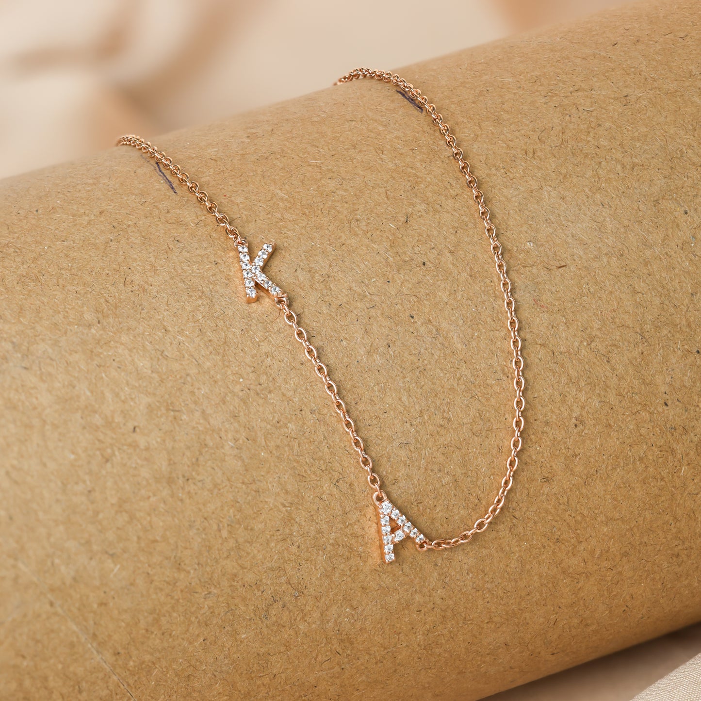 Delicate necklace featuring pave sideways letter