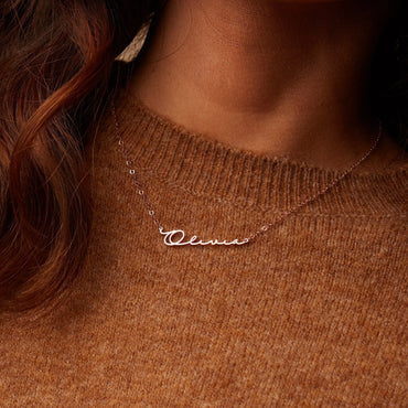 Necklace with simple name pendant.