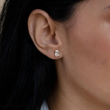 Close-up of Emerald Diamond Studs set in sterling silver.