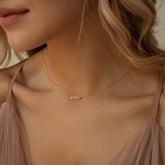Tiny Paris Name Necklace in elegant 18K gold, rose gold and sterling silver featuring a delicate personalized name pendant on a fine chain — a minimalist and chic everyday accessory.