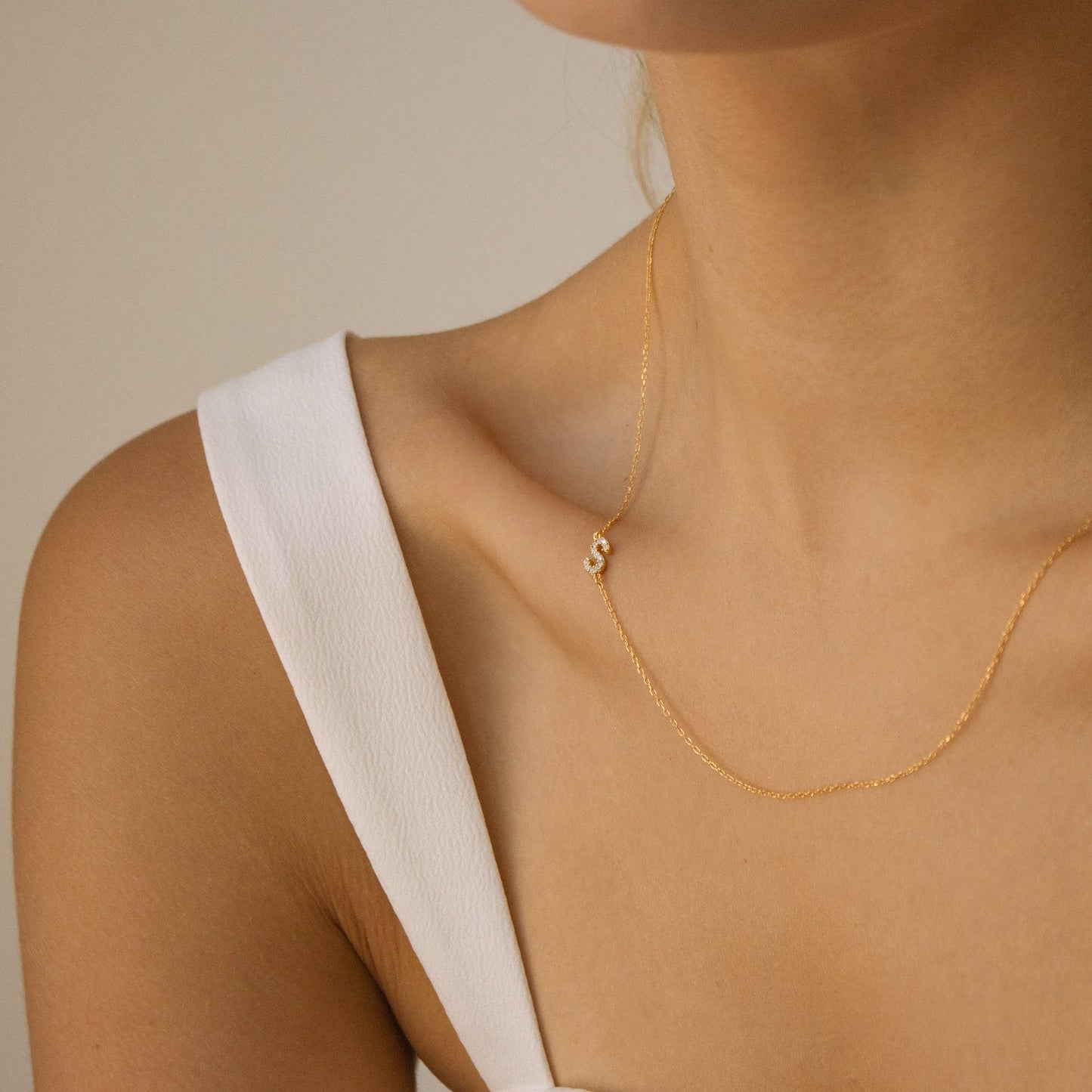 Necklace with pave-set sideways monogram
