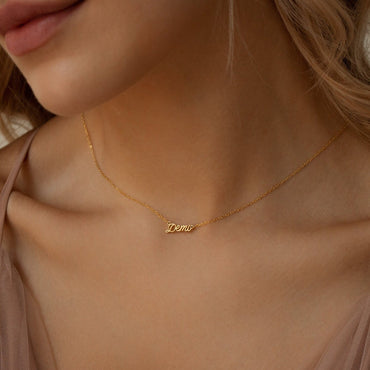Elegant personalized name necklace in 18K gold, rose gold and sterling silver featuring a custom name pendant on a delicate chain.