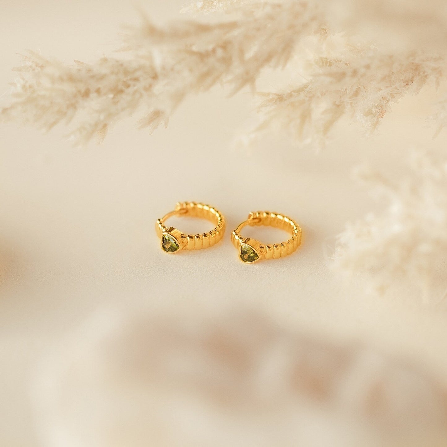 Unique Elegance: Peridot Heart Huggie Earrings