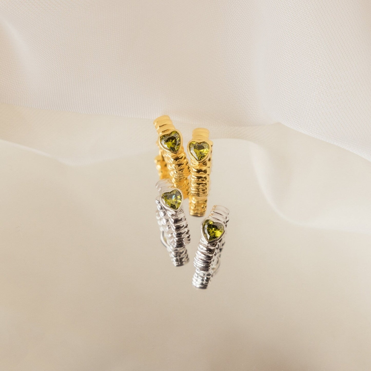 Unique Elegance: Peridot Heart Huggie Earrings