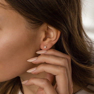 Timeless Elegance: Delicate Pearl Stud Earrings