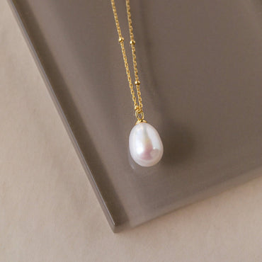 Timeless Elegance: Pearl Station Pendant Necklace