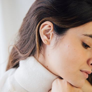 Pair of Arya Petal Stud Earrings with floral-inspired shape.