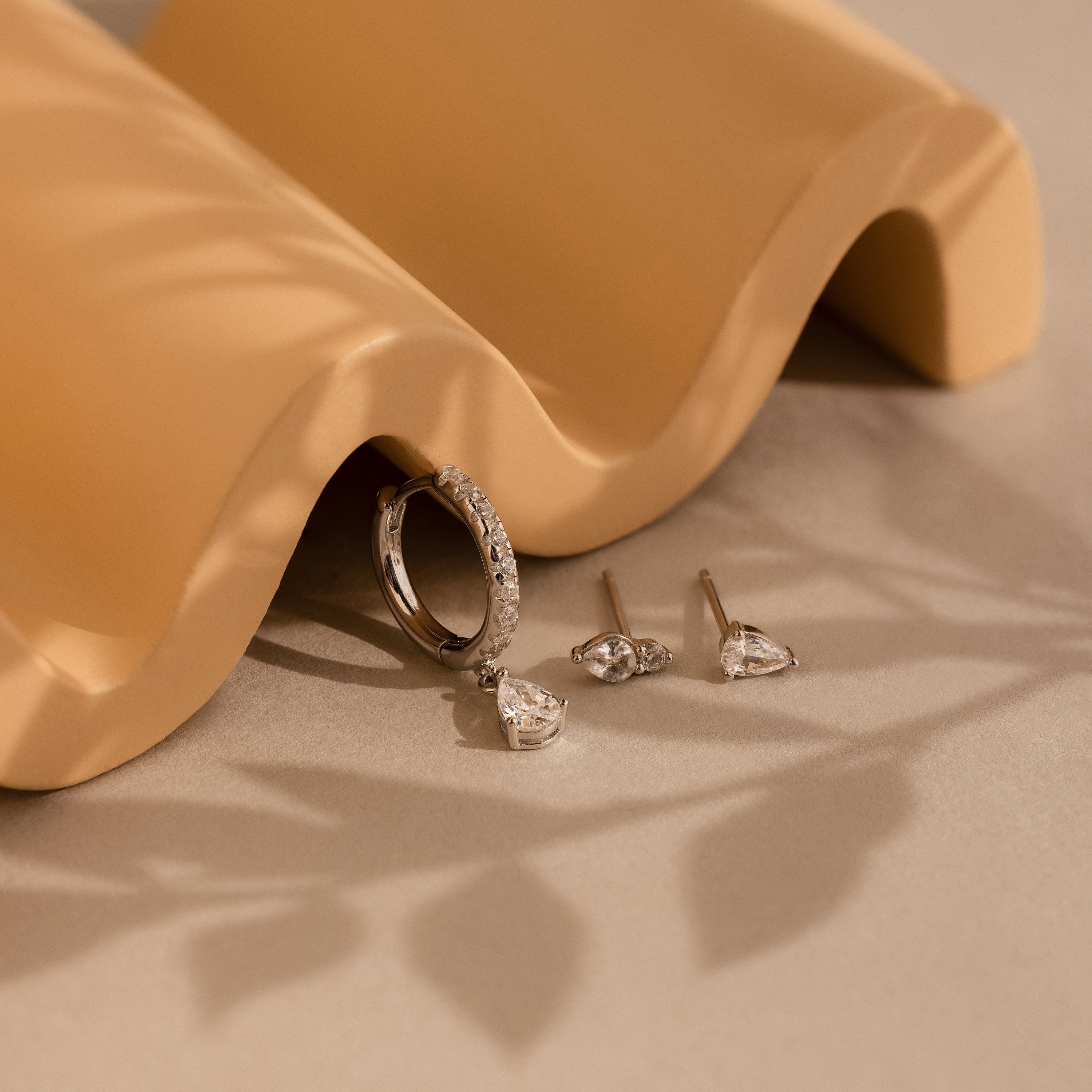 Timeless silver diamond drop earrings with elegant sparkle.