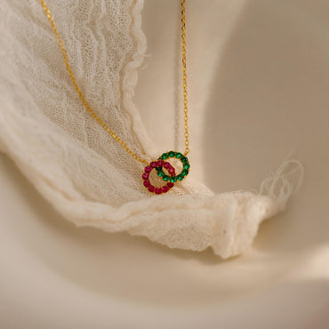 Personalized duo birthstone necklace with two sparkling gemstones.