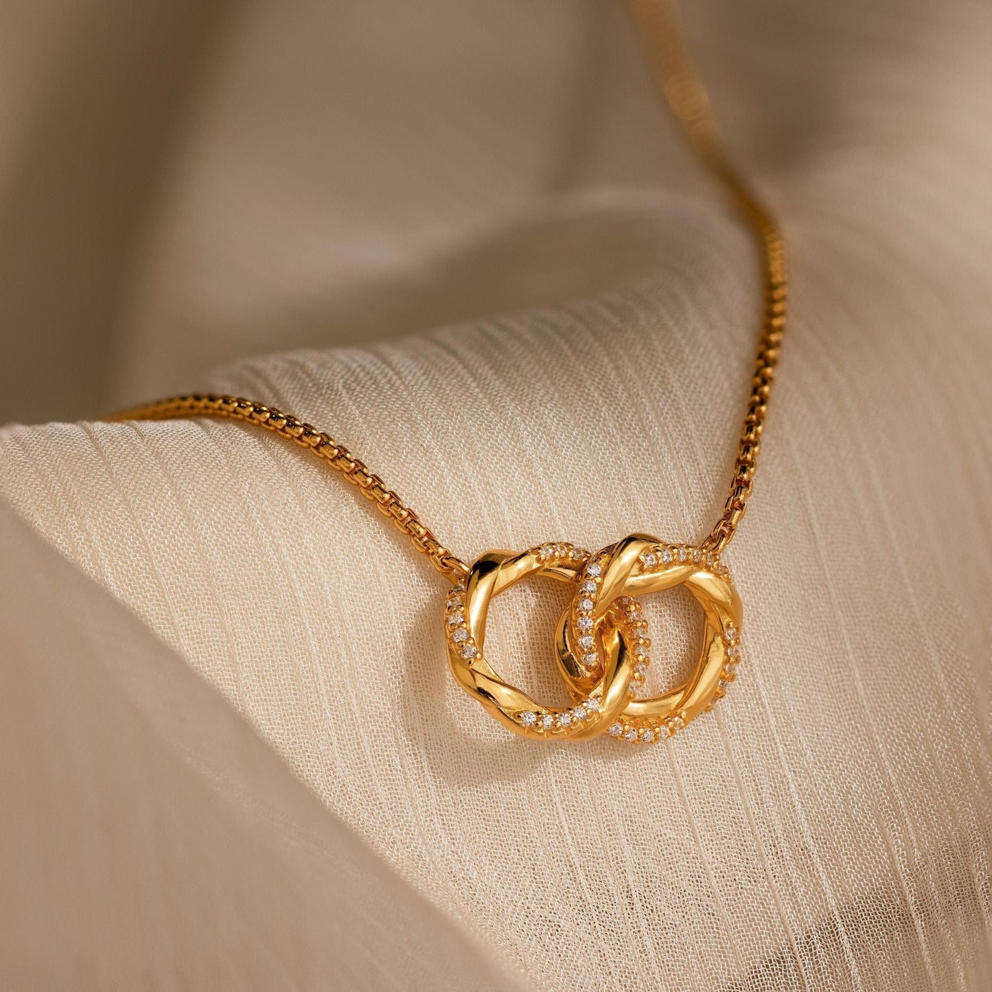 Love Linked Necklace in gold and silver finish, a meaningful gift symbolizing unity and everlasting bond.
