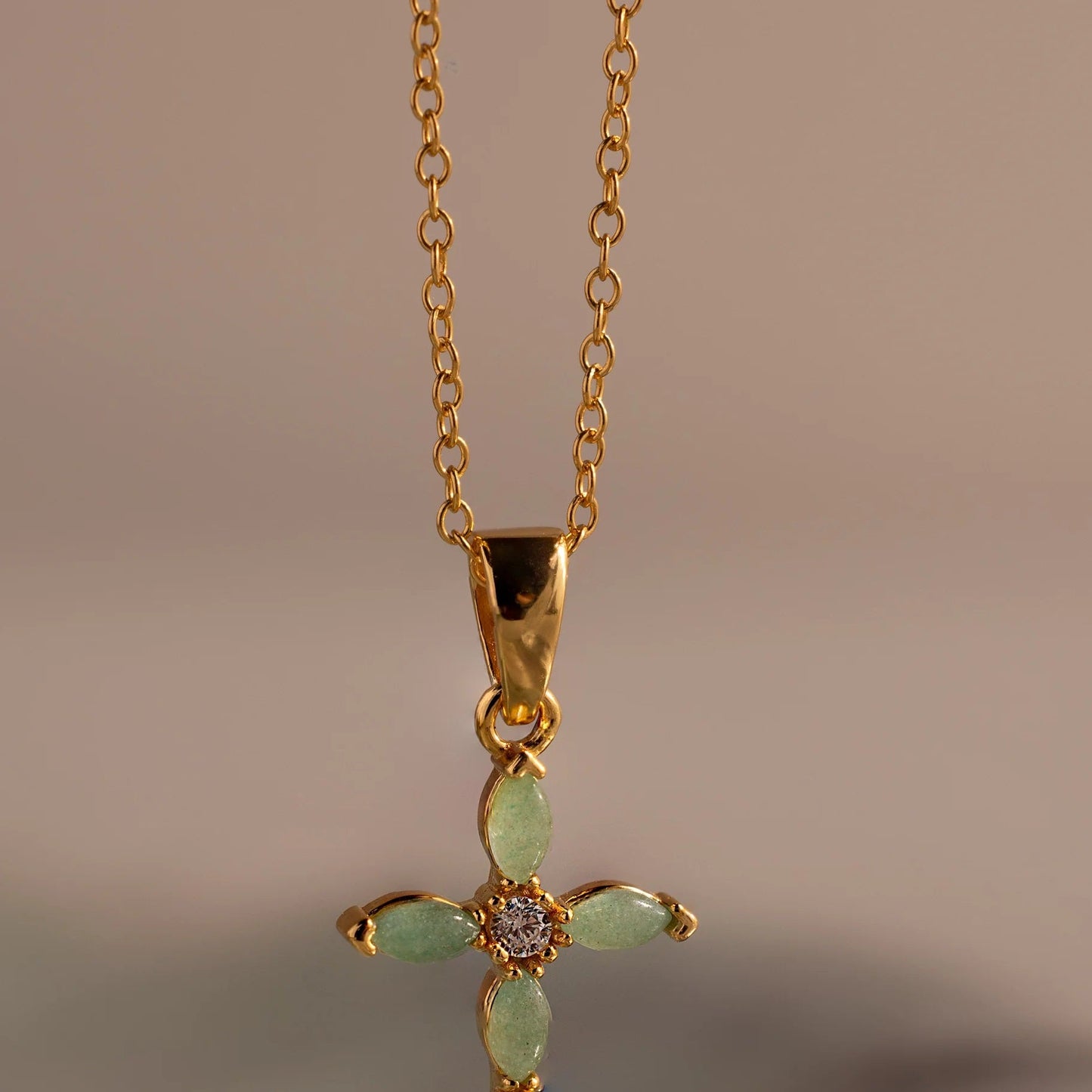 Elegant Serenity Jade Cross Necklace with luminous green marquise jade gemstones on a fine 18K gold chain by LUXEZ Jewels.