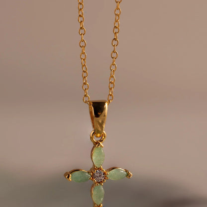 Elegant Serenity Jade Cross Necklace with luminous green marquise jade gemstones on a fine 18K gold chain by LUXEZ Jewels.