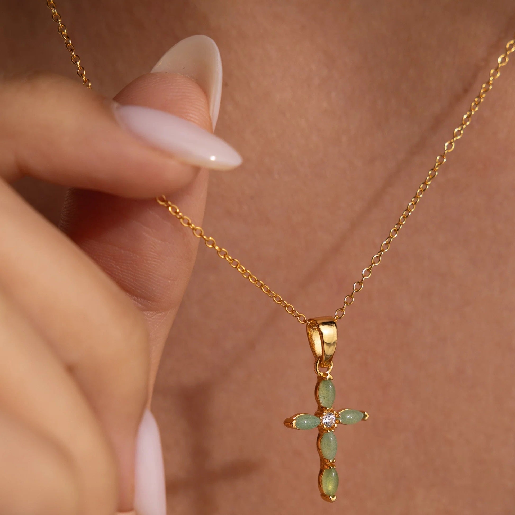 Close-up of marquise-cut jade gemstones forming a sleek cross pendant on the Serenity Jade Necklace by LUXEZ Jewels.