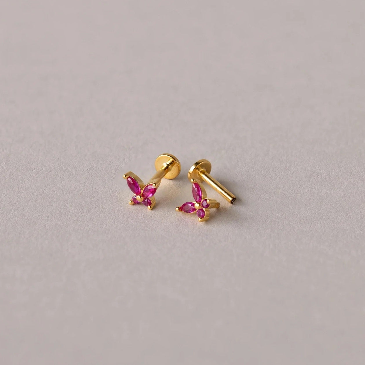 Mini Butterfly Birthstone Studs with july ruby birthstone