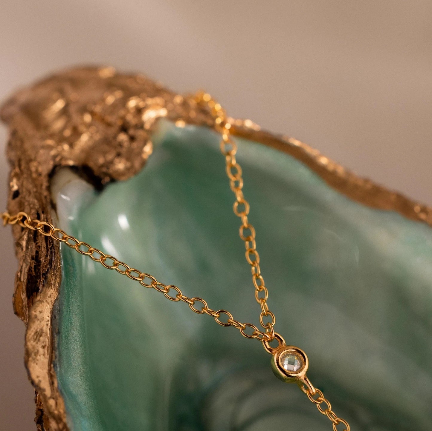 Delicate Ava Drop Chain Bracelet in 18K gold finish with CZ diamond accent by LUXEZ Jewels.