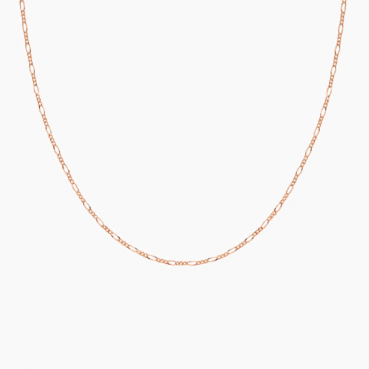 Rose gold chain necklace on a light gray background