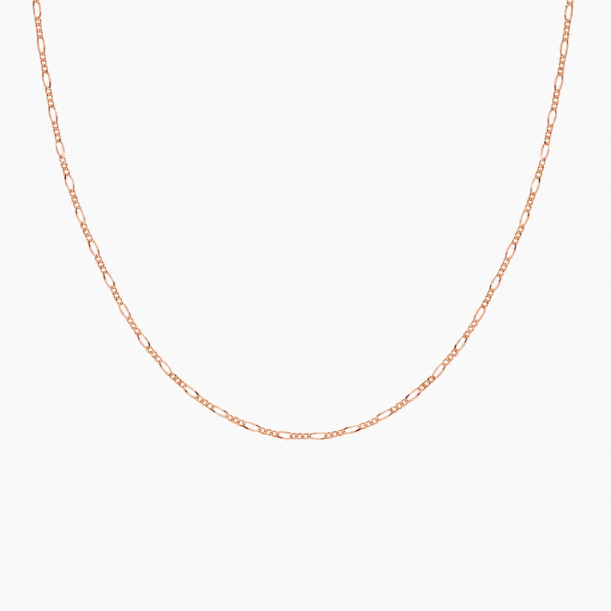 Rose gold chain necklace on a light gray background
