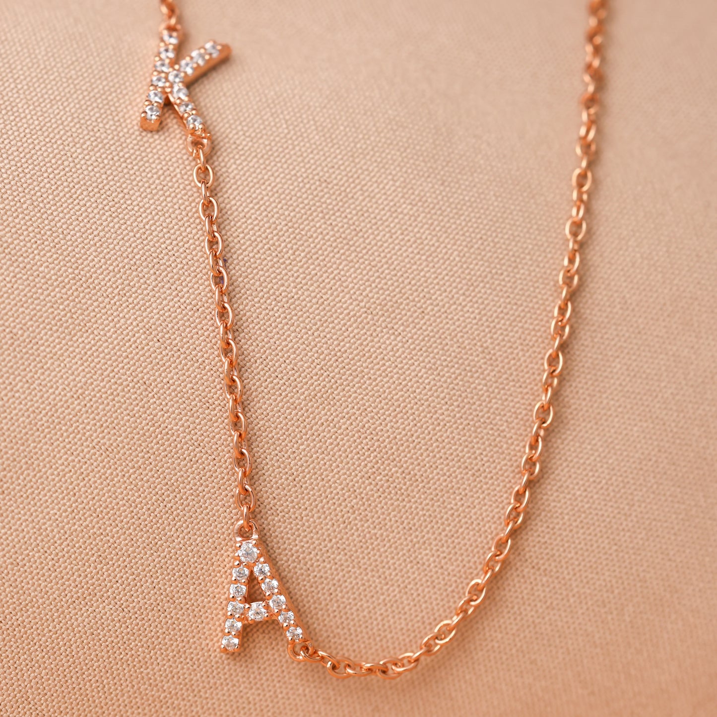Rose Gold sideways initial necklace with pave stones