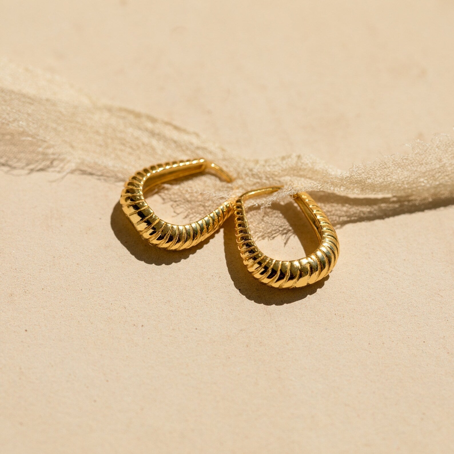 Embrace Bold Style with Our Ribbed Hoop Earrings 18K Gold