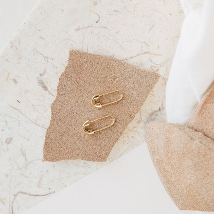Ava Minimalist Safety Pin Earrings, featuring sterling silver or 18K gold with edgy glamour, perfect for adding a bold and eclectic touch to your style