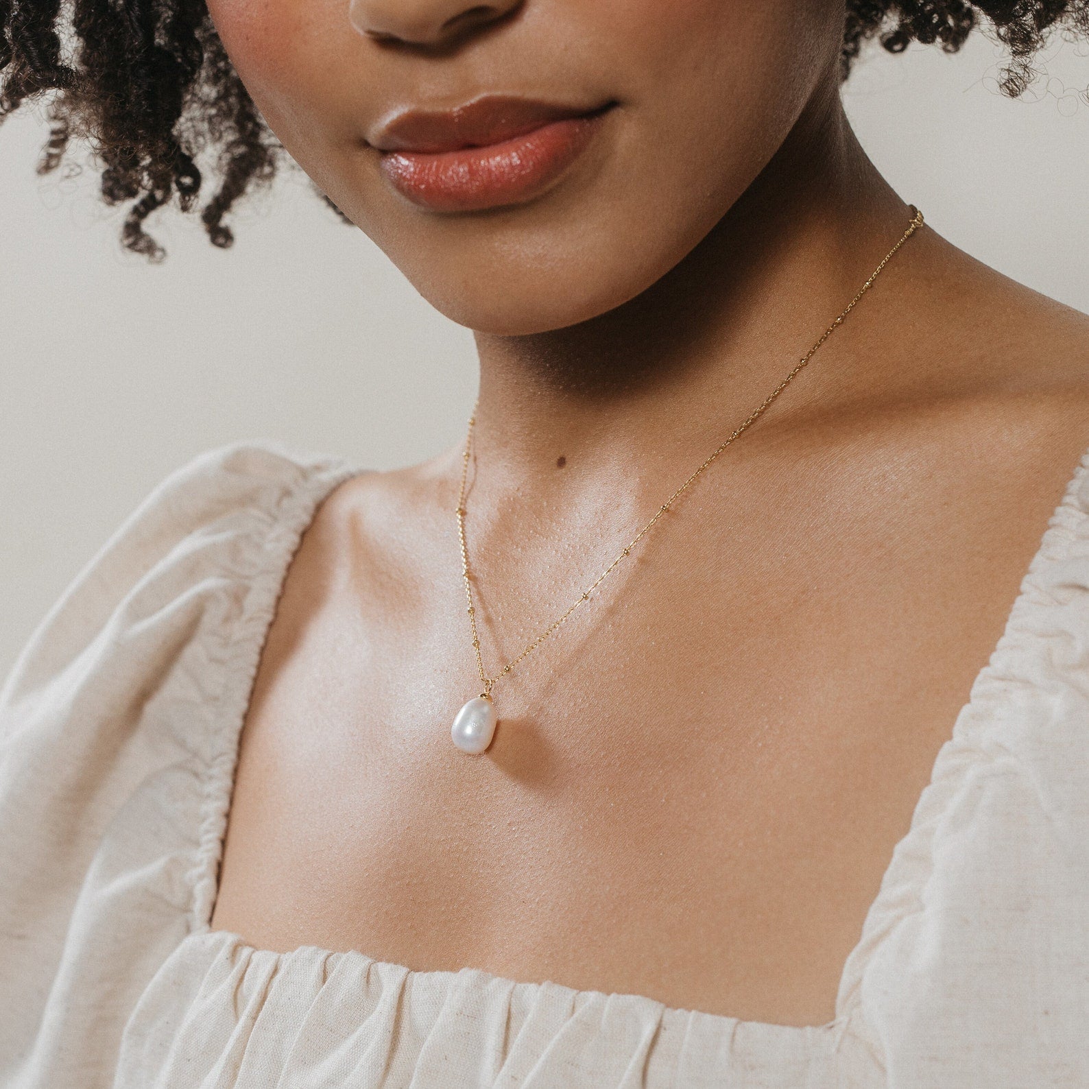 Timeless Elegance: Pearl Station Pendant Necklace