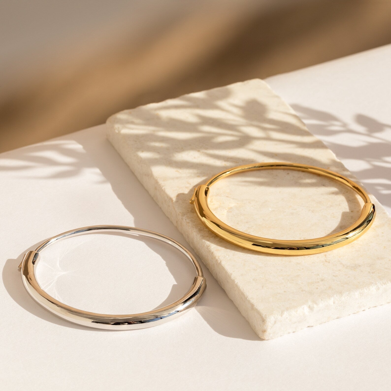 Aris Hinge Bangle, a modern vermeil cuff bracelet in sterling silver or 18K gold, featuring a sleek and streamlined design for effortless style