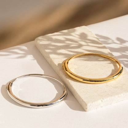 Aris Hinge Bangle, a modern vermeil cuff bracelet in sterling silver or 18K gold, featuring a sleek and streamlined design for effortless style