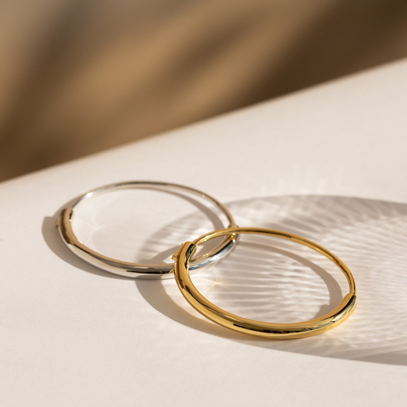 Aris Hinge Bangle, a modern vermeil cuff bracelet in sterling silver or 18K gold, featuring a sleek and streamlined design for effortless style