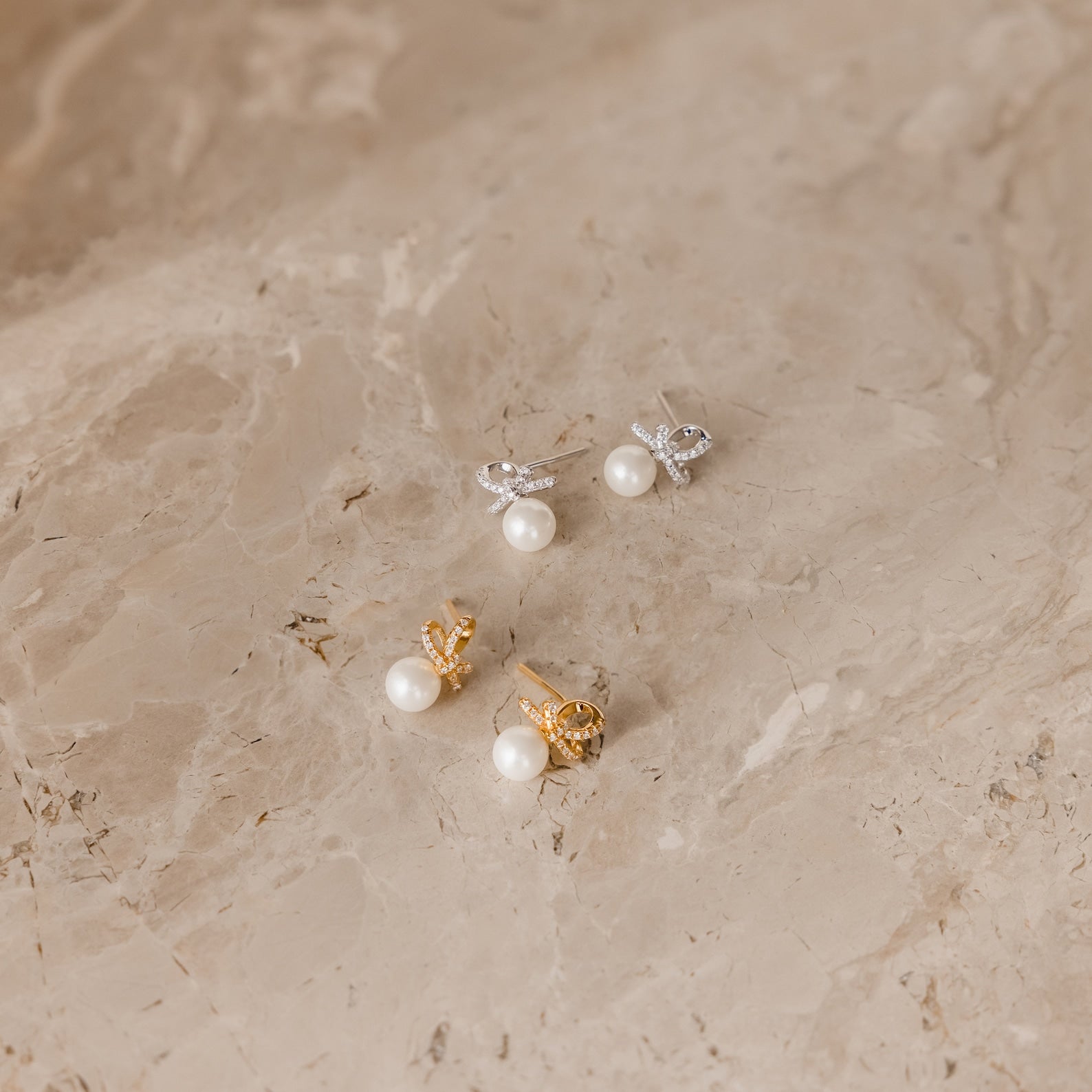 Charming Elegance: Pearl Bow Stud Earrings