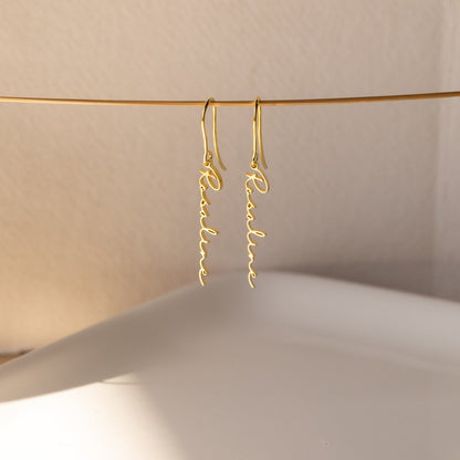 Personalized name earrings in sterling silver, 18K gold, or rose gold, featuring custom name or text in a elegant font
