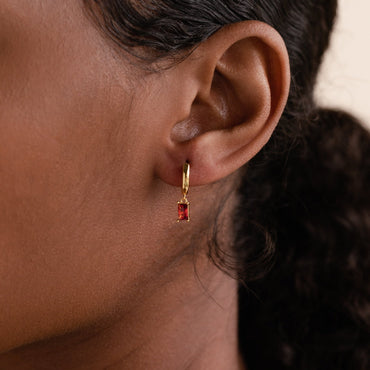 Subtle Birthstone Sparkle: Baguette Birthstone Huggie Hoops 18K Gold January Garnet