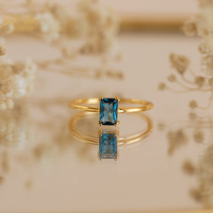 Embrace Vintage Elegance with the Blue Topaz Emerald Ring