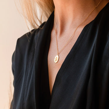 Necklace with bee coin charm