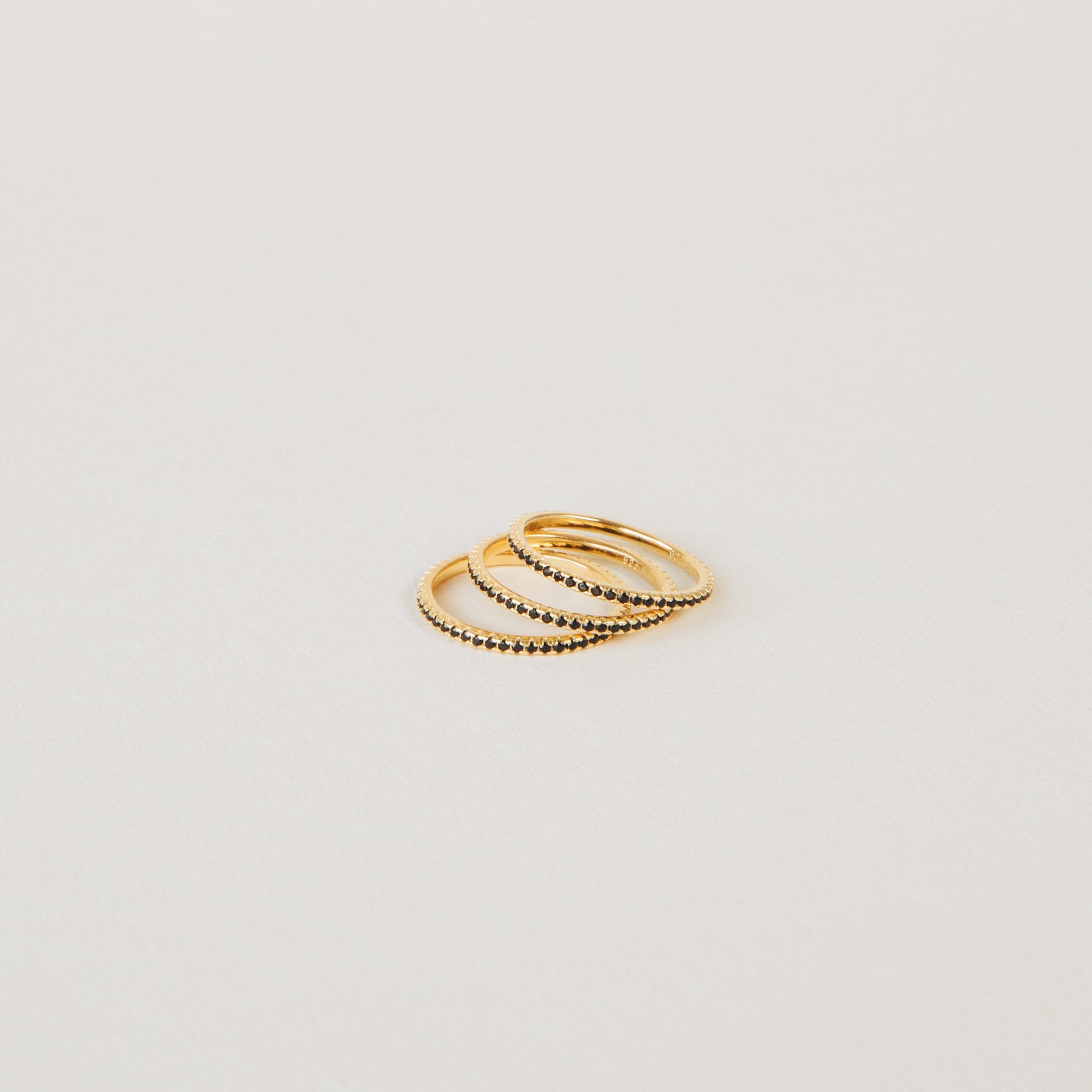 Amber Eternity Ring featuring CZ black diamonds on a sterling silver or 18K gold band, perfect for everyday wear or as a statement piece