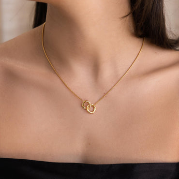 Luxez Jewels Love Linked Necklace featuring two interlocking circles in 18K gold over 925 sterling silver.