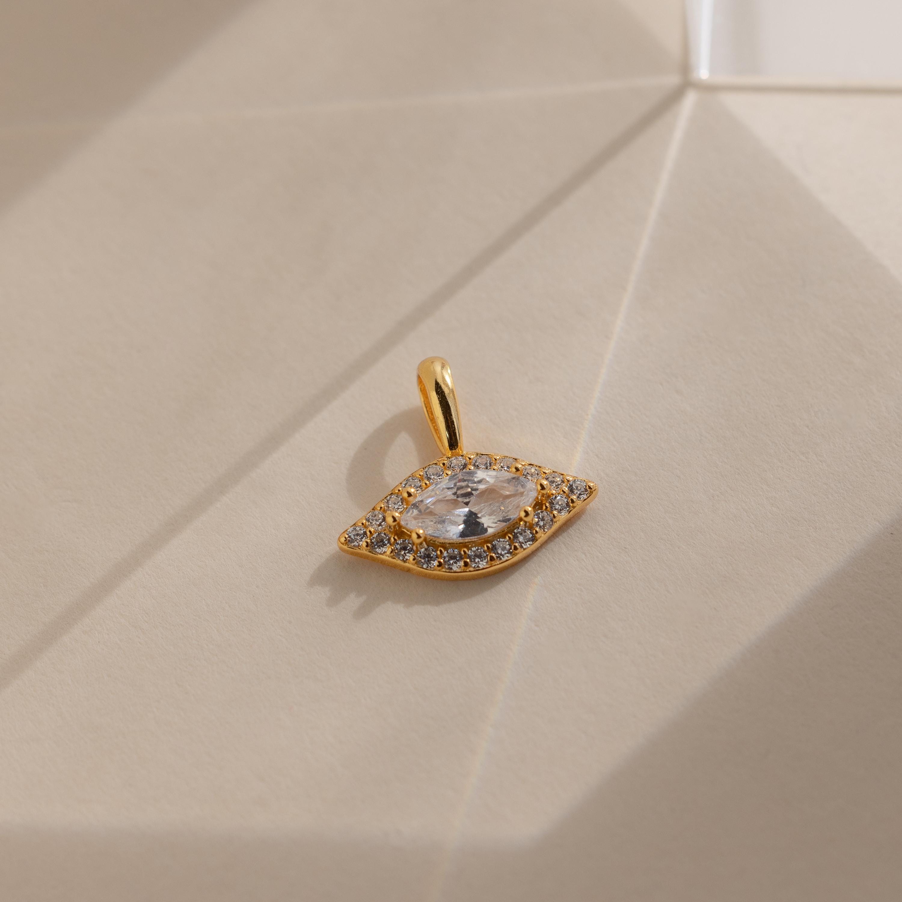 Evil eye pendant with sparkling pave details.