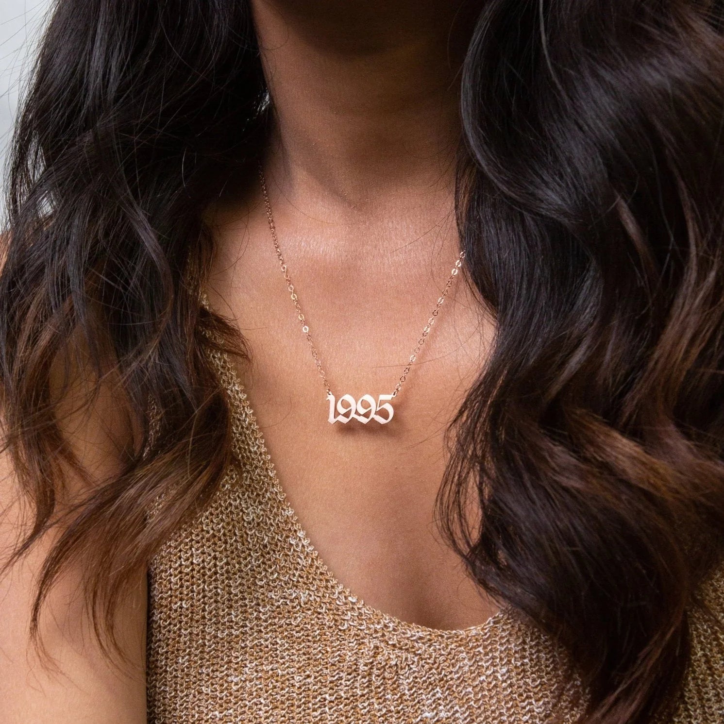 Delicate necklace featuring a year charm