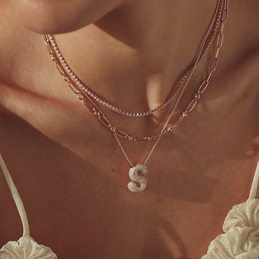 Personalized initial necklace with pave diamonds.