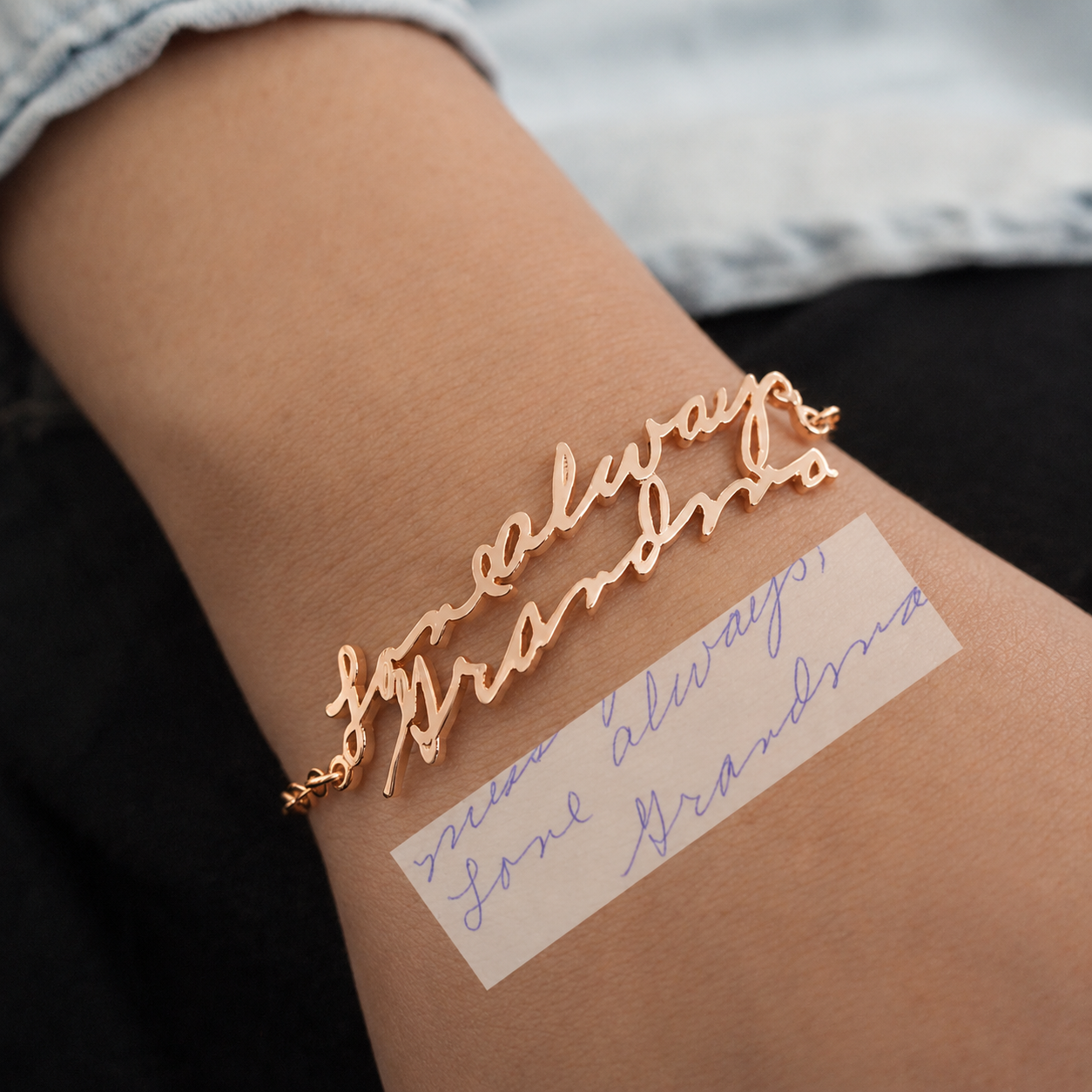 Rose gold bracelet with 'always' text on wrist, matching tattoo on skin
