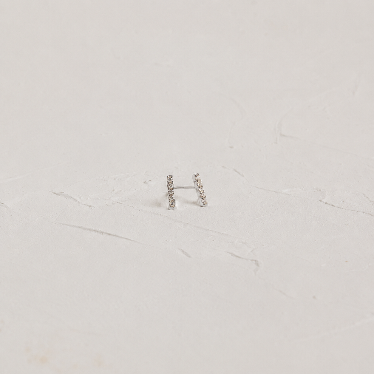 White background with Pave Bar Stud