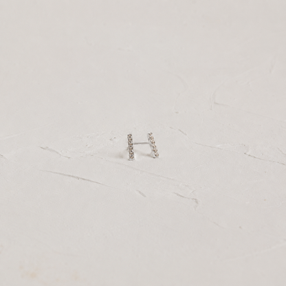 White background with Pave Bar Stud