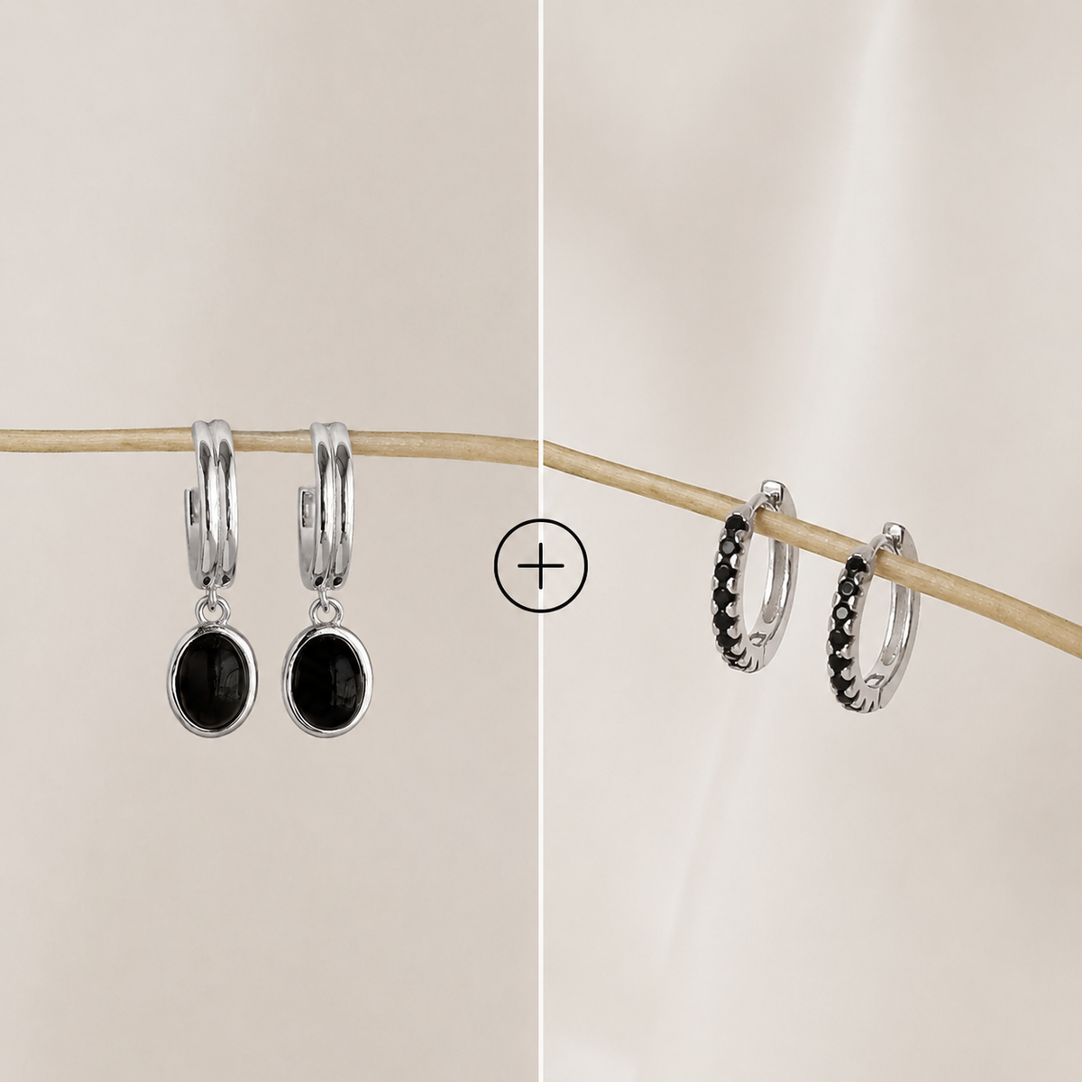 Two pairs of hoop earrings with black stones on a beige background