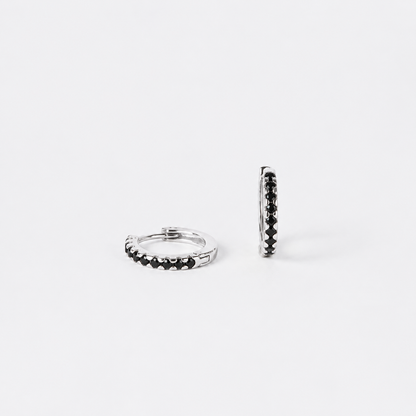 Two silver hoop earrings on a white background