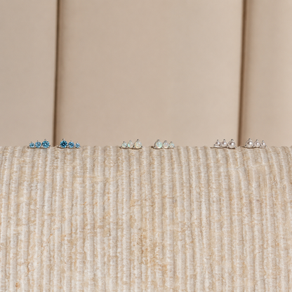 Small decorative items on a textured surface with a neutral background