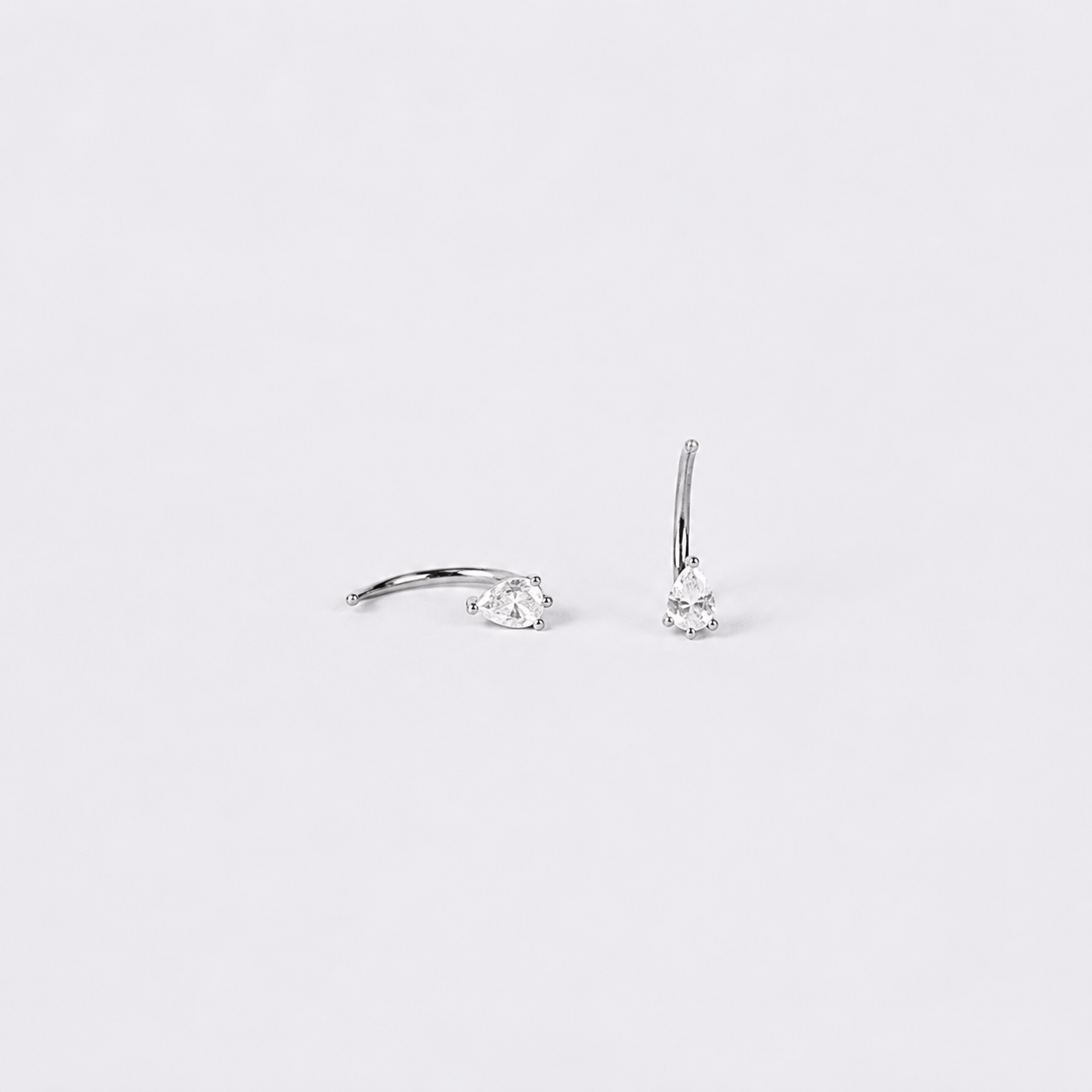 Black handbag with a chain detail on a white background