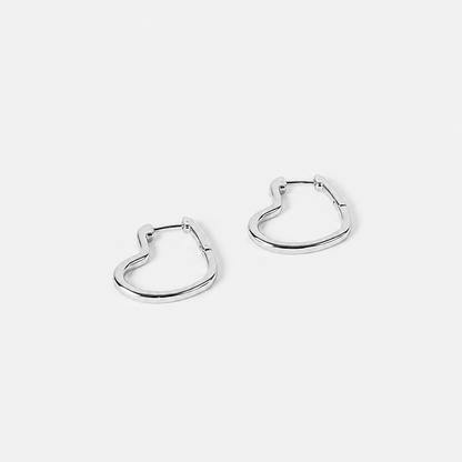 Pair of silver hoop earrings on a light gray background